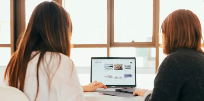 girls looking at laptop